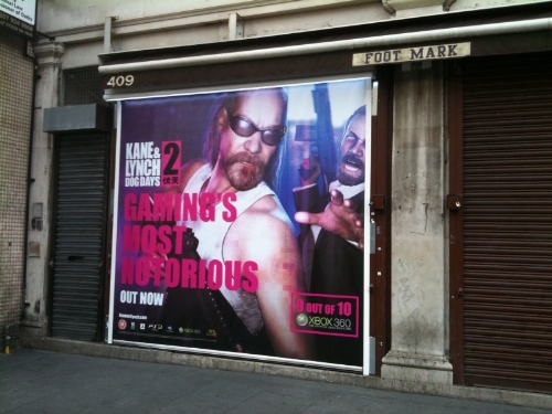 Shop shutter advertising on London high streets